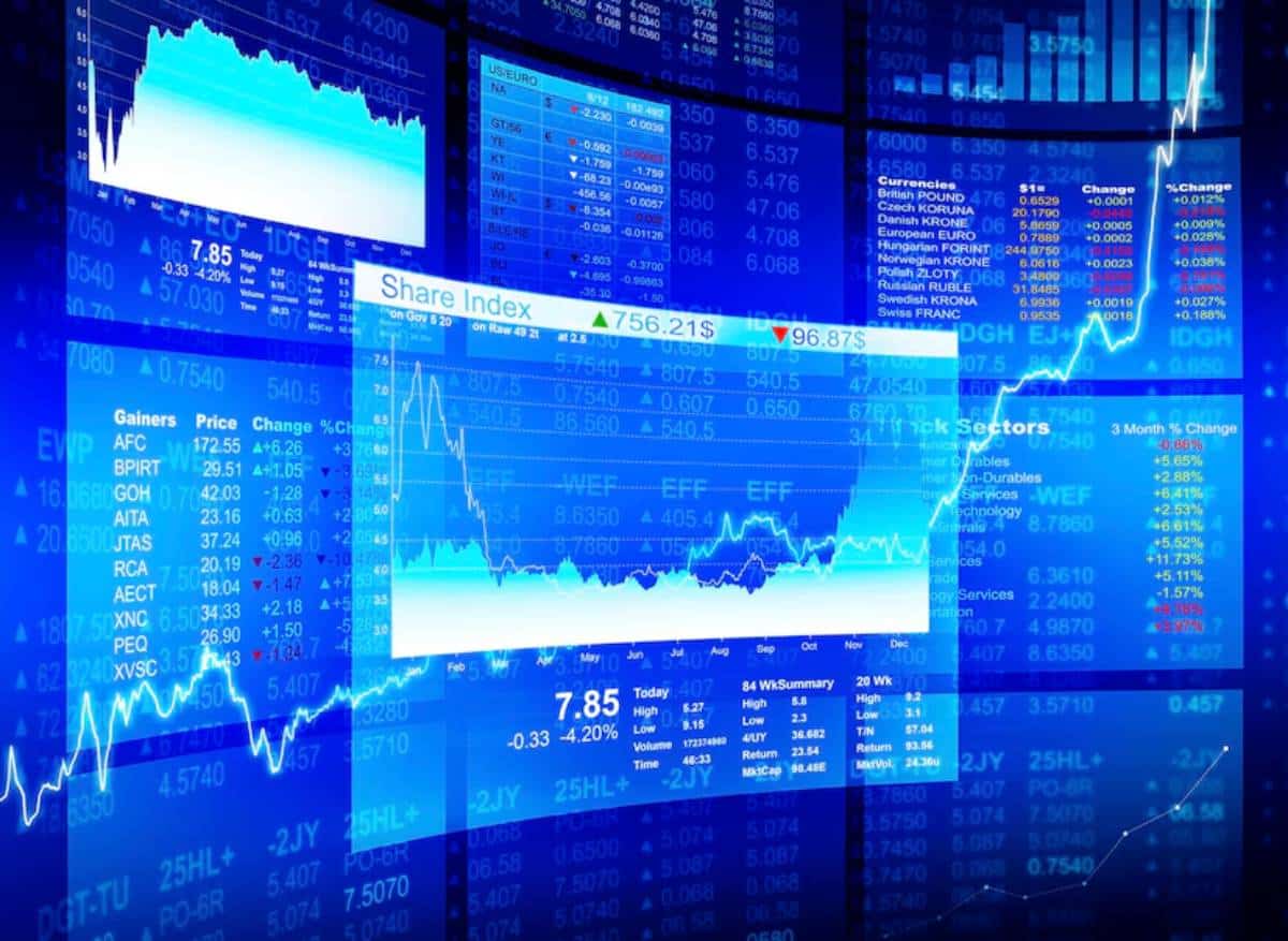 Complex display of stock market graphs, indexes, and numerical data overlaying each other in vibrant blue tones.